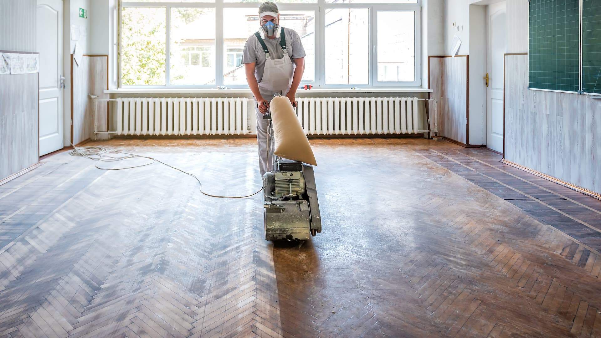 Sanding Hardwood Floor With The Grinding Machine
