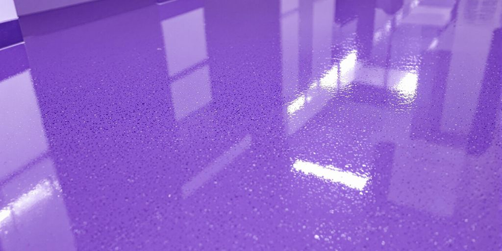 Close-up: shiny, wet, purple-blue UV-coated floor.