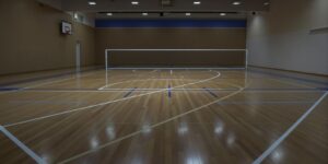 Smooth wooden futsal court, bright lines, Birmingham centre.