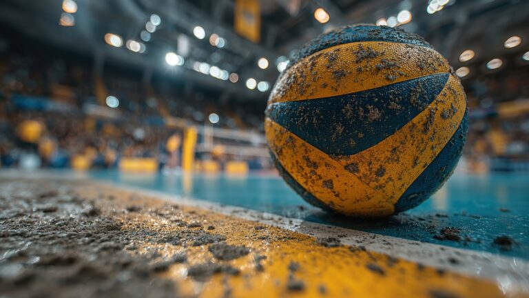 Close-up of a volleyball on an indoor court with a blurred background