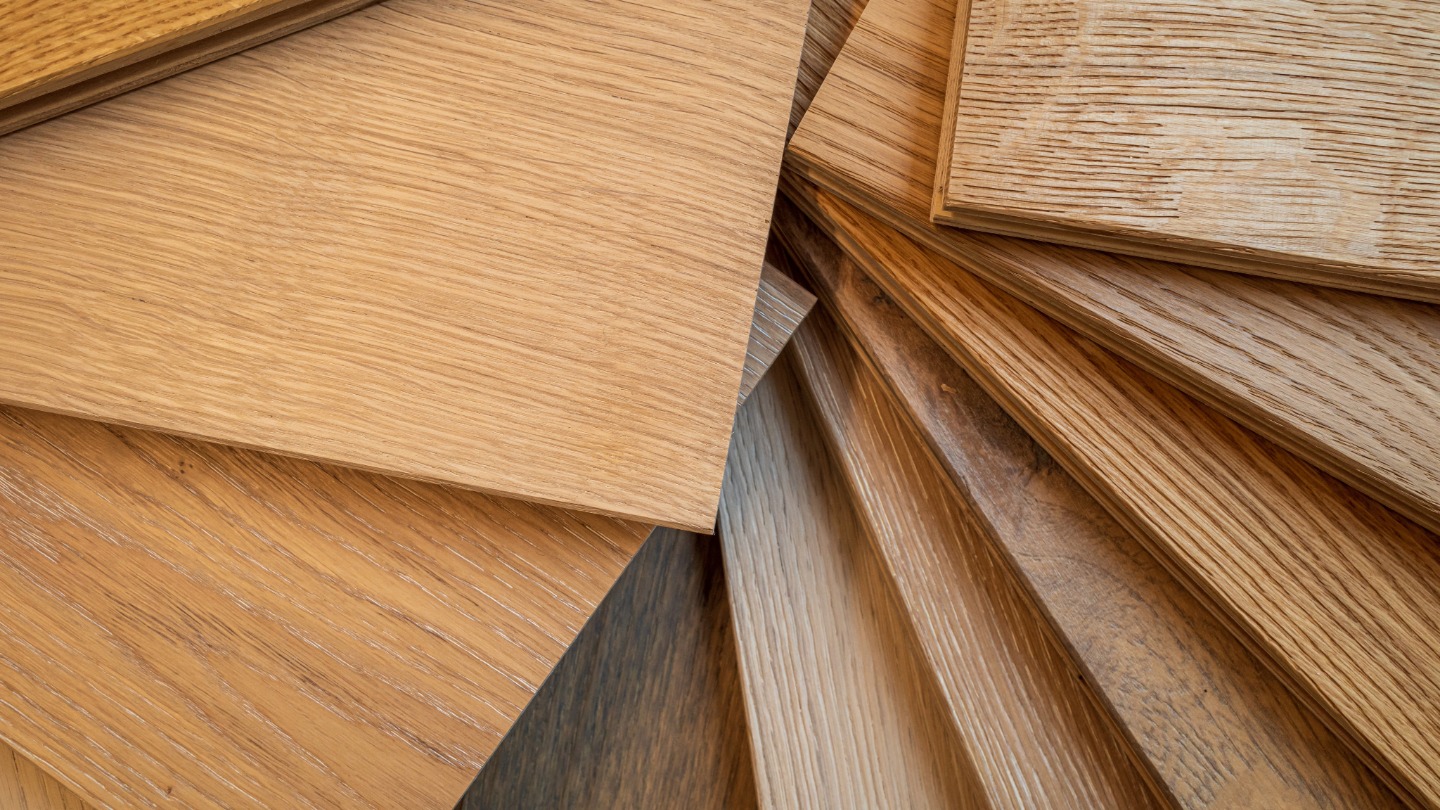 Various wooden floor samples displayed in a fan arrangement